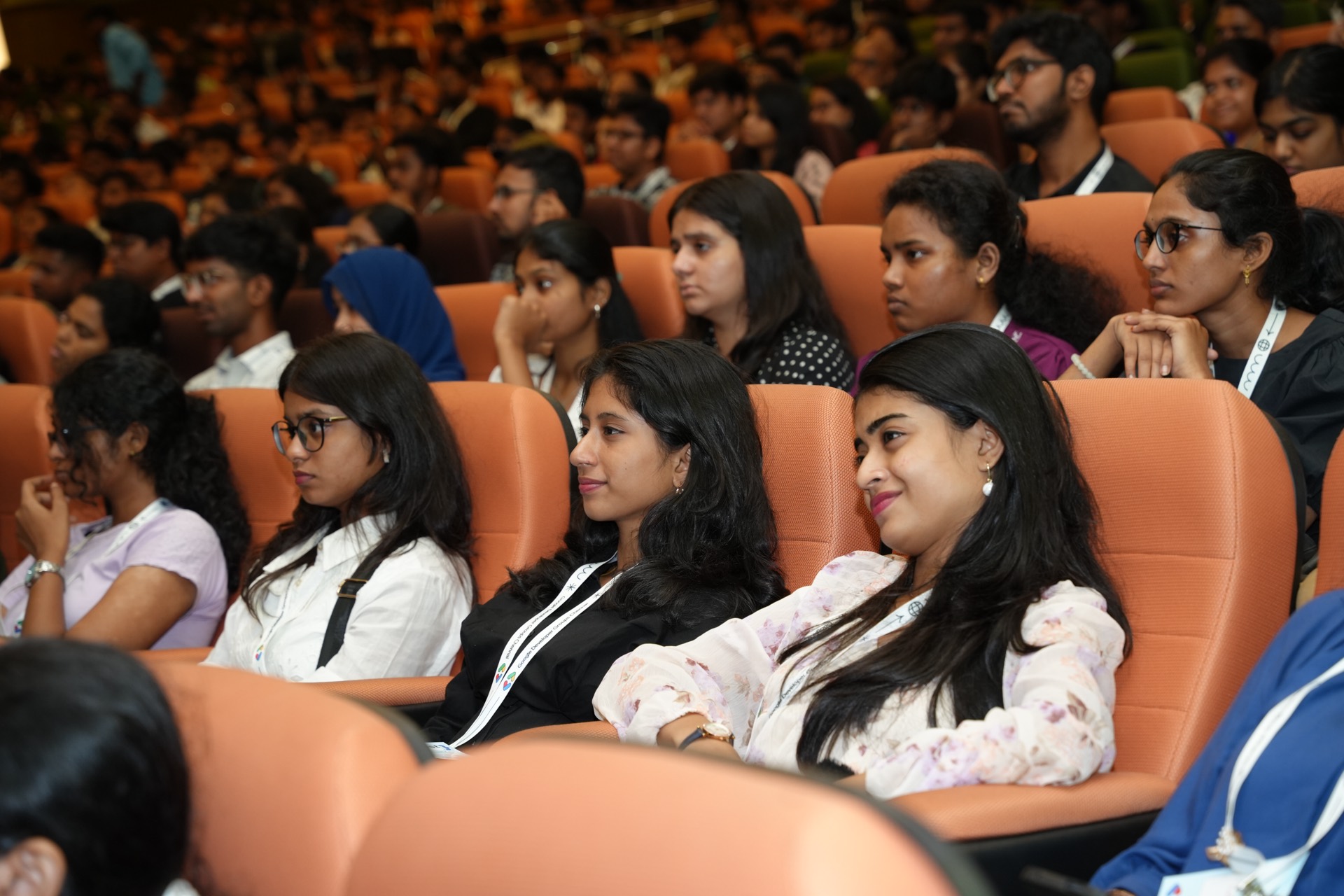 Attendees seated in the auditorium, listening to a talk.