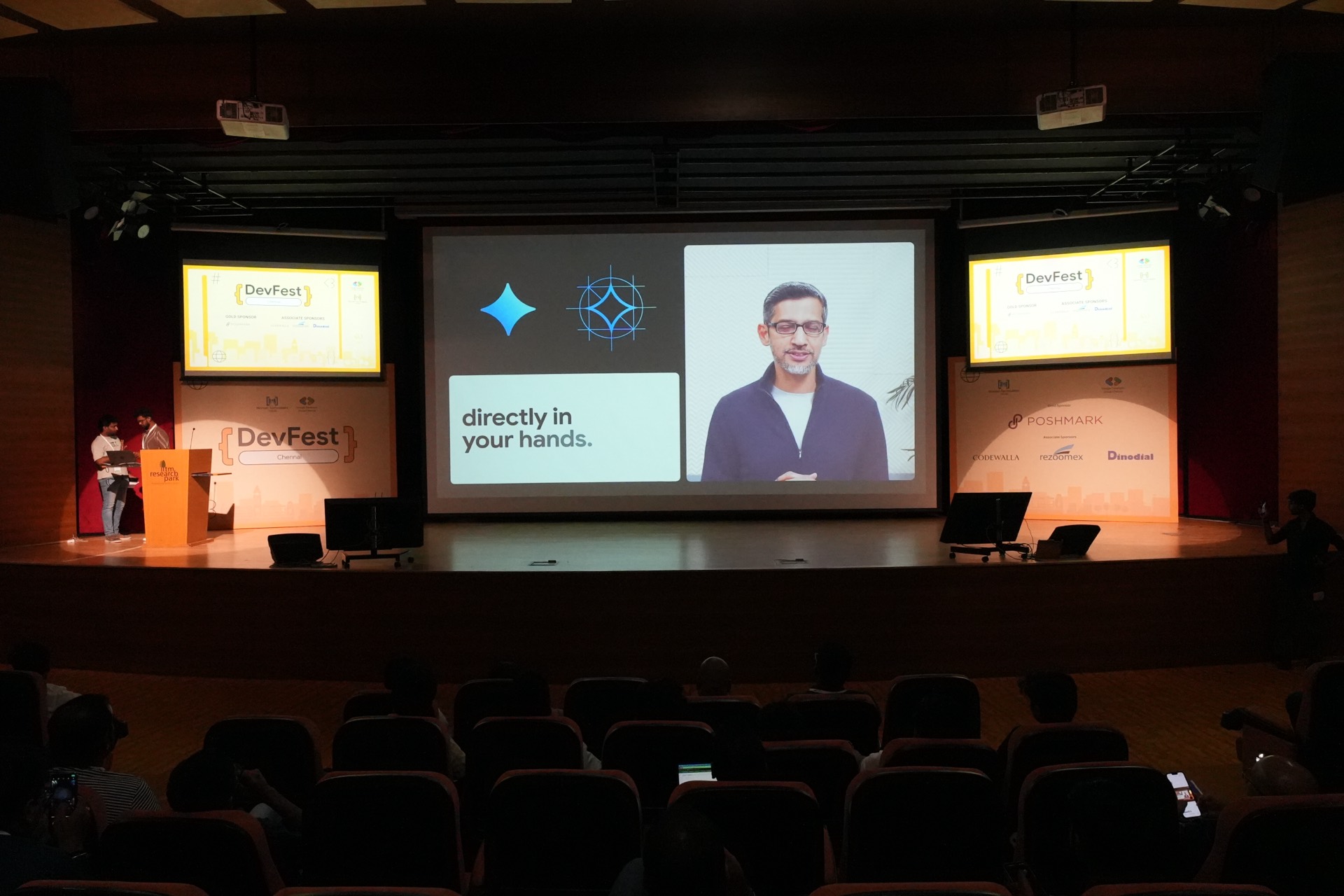 The auditorium watching the keynote play on the main screen.